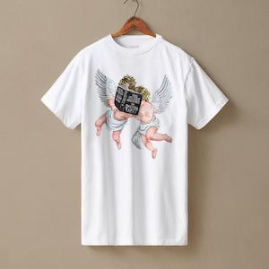 May include: White t-shirt with a watercolour illustration of two cherubs with wings, reading a book titled "The Secret History" by Donna Tartt. The design is centred on the shirt.