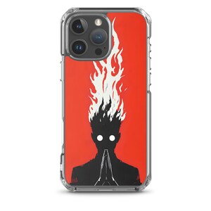 Puede incluir: Funda de teléfono transparente con fondo rojo. Presenta una silueta negra de una persona con llamas como pelo y ojos blancos brillantes, en posición de oración. La funda tiene un borde transparente.