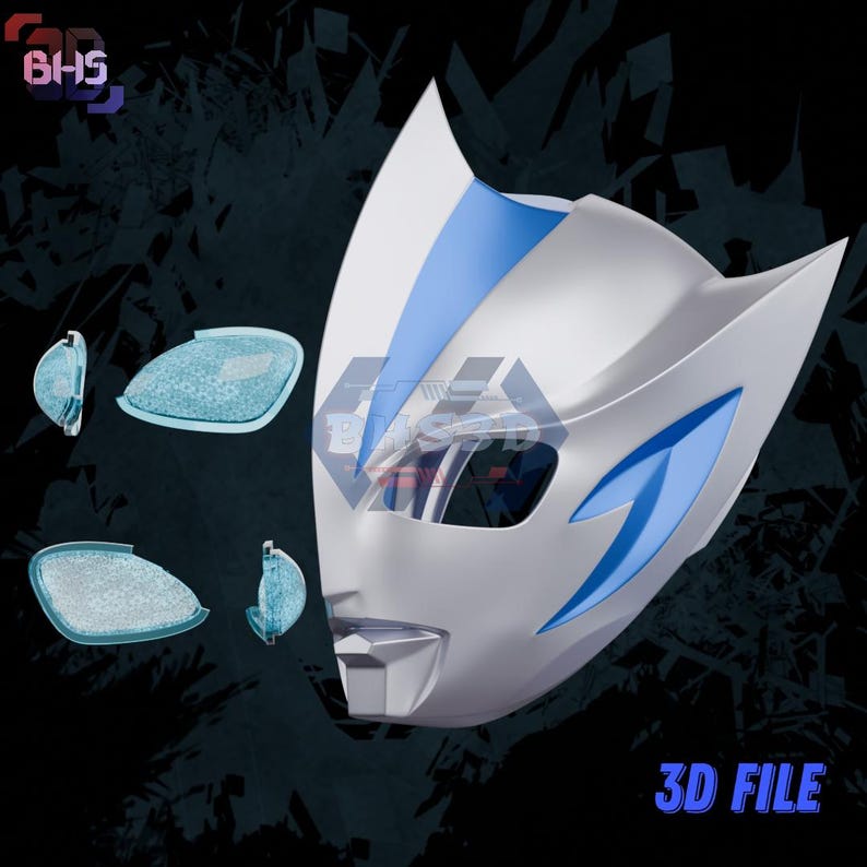 May include: A white and blue mask with a stylized design, featuring blue accents and eye lenses. The mask has a sleek, futuristic appearance. The text "3D FILE" is visible at the bottom.