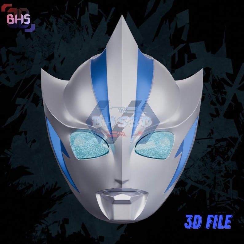 May include: A silver and blue mask with a pointed top and stylized features. The mask has blue accents and eye openings with a textured appearance. The text "3D FILE" is visible in the lower right corner.