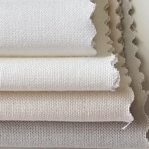 May include: Four pieces of white fabric stacked on top of each other. The fabric has a woven texture and is slightly off-white in color.