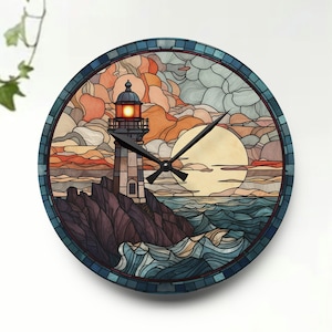 May include: A round clock with a stained glass design featuring a lighthouse, waves, and a sunset. The clock face is white with black hands.