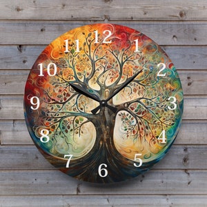 May include: A round clock with a colorful tree of life design. The clock face features Roman numerals and a black clock hand. The background is a mix of orange, yellow, green, and blue.