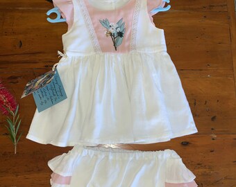 Baby girl dress set with matching ruffle bum nappy cover. Handmade embroidered with Australian native blossoms. Size 6 months.