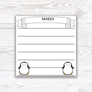 Pode incluir: Um bloco de notas imprimível com uma faixa que diz "NOTES" e dois pinguins na parte inferior. O bloco de notas tem linhas cinzas para escrever.