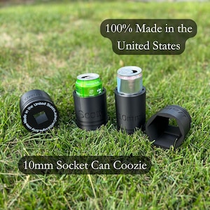 May include: Three black 10mm socket can koozies, made in the United States, with the text "100% Made in the United States" above them. The koozies are on a green grassy surface.