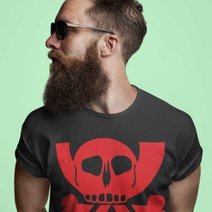 May include: A black t-shirt featuring a red skull and crossbones design. The skull has a white face and black eyes.