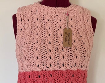 Hand made vest. We hand knitted this vest in cotton and included a stylish lace design.