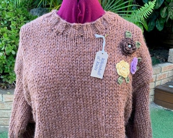 Hand made brown jumper with applique flowers. Hand knitted in 100% recycled yarn. Soft easy care yarn that's helping save the environment.