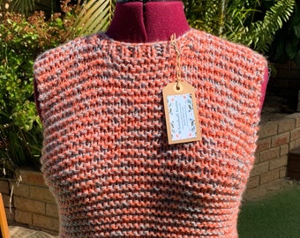 Hand made modern and stylish vest. Hand knitted in acrylic yarn.  Thick, cuddly and soft, using double strands of grey and orange yarns.