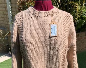 Hand made jumper. We hand knitted this garment in easy care acrylic/wool blend.  Chunky and thick beige jumper featuring textured panels