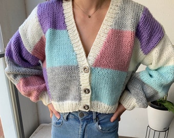 Hand made Cardigan. We hand knitted this in easy care double acrylic. Cropped at waist. Pastel coloured patchwork design.