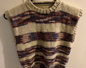 Hand knitted vest. We hand knitted this vest in easy care acrylic.  The vest is round neck and knitted in brown shaded variegated yarn.