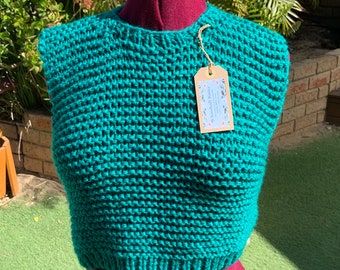 Hand made cropped vest. We hand knitted this vest in easy care soft acrylic yarn. Modern and stylish design in a stunning shade of green.