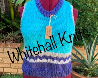 Hand made patterned vest.  We hand knitted the vest in easy care acrylic yarn. Thick, soft and cuddly. Free delivery within Australia.