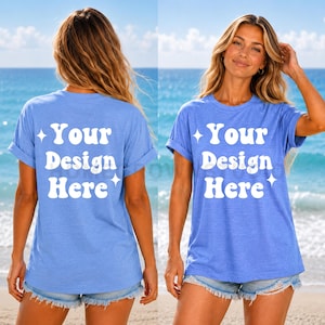 May include: A light blue short-sleeved t-shirt with rolled sleeves and a crew neckline. The front and back feature the white text "Your Design Here" in a bold, rounded font, accented by small four-pointed star icons on either side of the text.