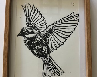 Originele linoprint van een enkele vogel in de vlucht