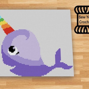 May include: A crochet pattern for a purple narwhal with a rainbow horn. The pattern is called "Sew You Crochet".