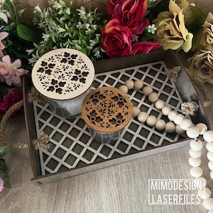 May include: A decorative wooden tray with a lattice design holds two glass jars with floral-patterned wooden lids. The tray has rope handles and is surrounded by flowers and wooden beads. The text "MIMODESIGN LASERFILES" is visible.