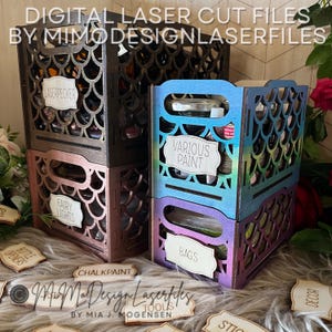 May include: Laser-cut wooden storage crates in black, rose gold, and a blue-purple gradient. The crates have a decorative fish scale pattern and labels that read "Laserpecker", "Fairy Lights", "Various Paint", and "Bags". The text "Digital Laser Cut Files" is at the top.