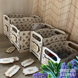 May include: Five wooden storage boxes with decorative cutouts and labels. The labels read "Tools", "Chalkpaint", "Keychains", "Tags", "Earring Hardware", "Fin Shap", and "Ribbon".