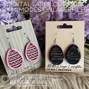 May include: Two pairs of earrings on display cards. One pair is pink with a wavy design and the other pair is brown and teal with a wavy design. The cards have the text "MiMo Design Laserfiles by Mia J. Mogensen" printed on them.