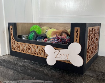 May include: Black wooden dog toy storage box with a cutout design and a bone-shaped name tag that says "Zoey".