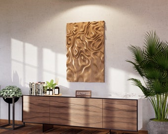 May include: A wooden wall art piece with a swirling, abstract design. The art is mounted on a white wall above a wooden cabinet with a label that reads "LA FABRICA".