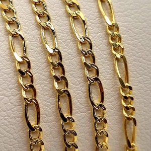 May include: Four gold chains of different lengths, all featuring a classic figaro chain design.