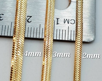May include: Three gold snake chains of different widths, measured against a ruler. The chains are 4mm, 3mm, and 2mm wide.
