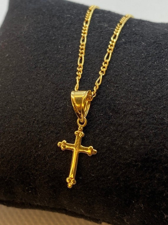 Gold figaro chain shop with cross
