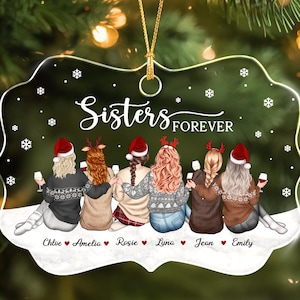 May include: A decorative ornament with a scalloped edge featuring the text Sisters FOREVER. The illustration shows six people from behind wearing winter sweaters and Santa hats, holding wine glasses. Names Chloe, Amelia, Rosie, Lyna, Jean, and Emily are printed below.