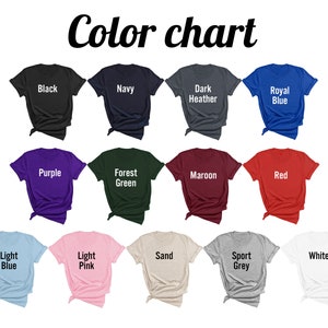 May include: Color chart showing 12 different t-shirt colors: black, navy, dark heather, royal blue, purple, forest green, maroon, red, light blue, light pink, sand, sport grey, and white.