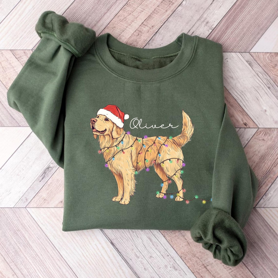 Green sweatshirt featuring a festive Christmas Golden Retriever with holiday lights and a Santa hat.