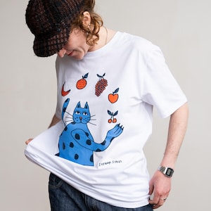 Katze jonglierende Frucht T-Shirt