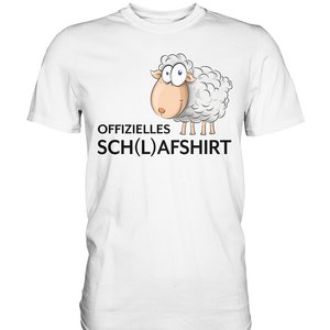 Puede incluir: Camiseta blanca con una oveja de dibujos animados y el texto "OFFIZIELLES SCH(L)AFSHIRT"