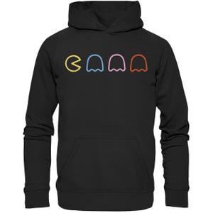 Könnte beinhalten: Schwarzer Kapuzenpullover mit einem Pac-Man und vier Geistern in Regenbogenfarben, die auf der Vorderseite aufgedruckt sind.