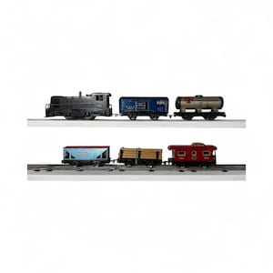 May include: A collection of vintage toy train cars and a locomotive. The train cars are in various colors, including black, blue, red, and brown. The locomotive is black. The train cars are on a track.