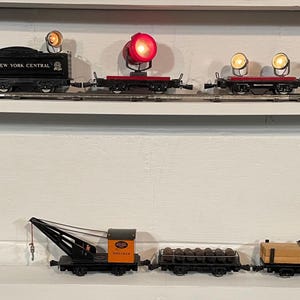 Marx Steam Train with lighted cars as curated by Roy