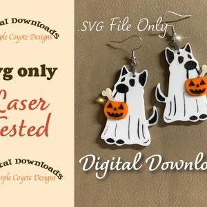 May include: A digital download of a pair of white ghost dog earrings with black eyes and a black nose. Each dog is holding a small orange pumpkin with a jack-o-lantern face. The earrings are laser tested and are available as an SVG file only. The text "Digital Downloads Purple Coyote Designs" is at the top and bottom of the image.