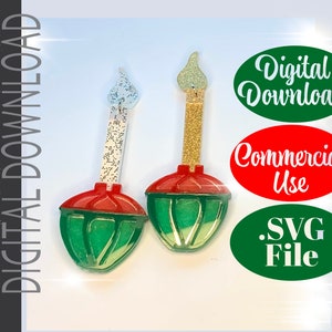 May include: Two green and red Christmas ornaments with a white and gold glitter candle on top. The ornaments are shaped like a light bulb. The image includes the text "Digital Download", "Commercial Use", and ".SVG File".