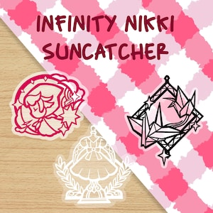 May include: Two stickers featuring characters from the mobile game Infinity Nikki Suncatcher. The first sticker is pink and features a girl with a star on her head. The second sticker is black and features a stylized origami crane.