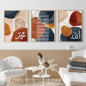 May include: Three abstract art prints with Arabic calligraphy in white on a blue, brown, and orange background. The prints feature abstract shapes and patterns in shades of blue, brown, and orange.