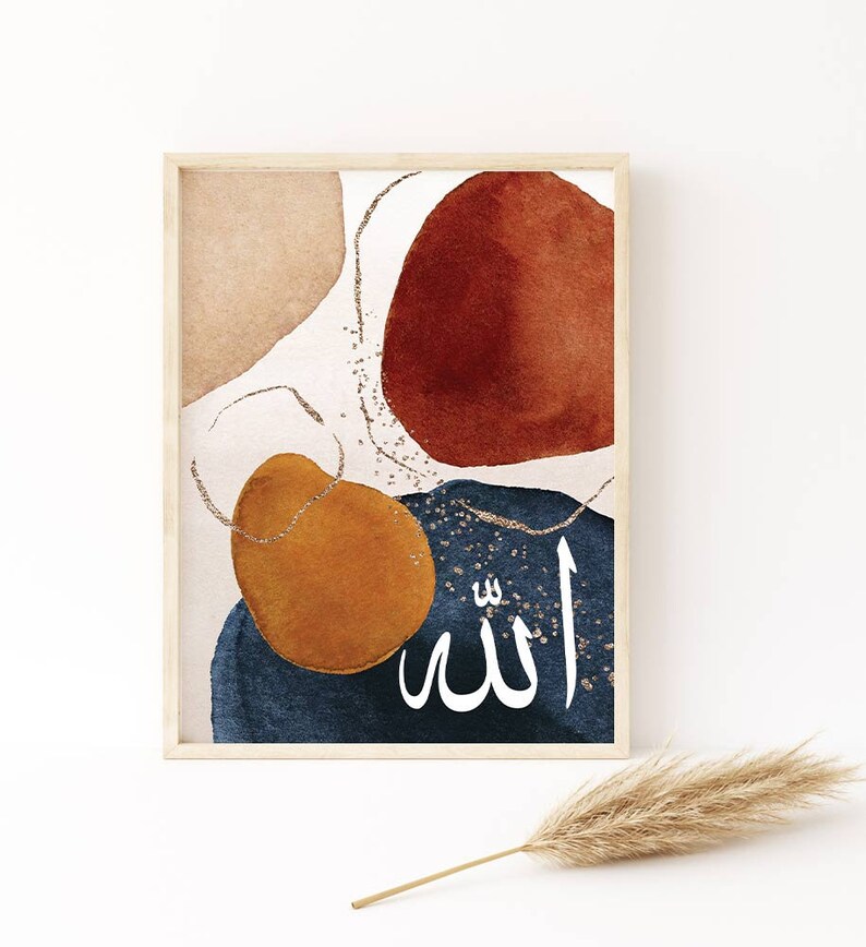 May include: Abstract art print featuring watercolour shapes in shades of brown, orange, blue, and white. The Arabic word "Allah" is written in gold glitter on a blue background.
