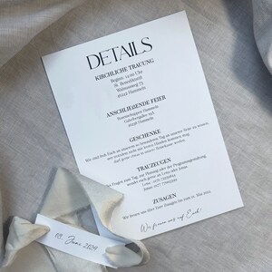 May include: A white card with black text detailing a wedding ceremony and reception. The card includes the date, time, and location of the wedding ceremony and reception, as well as the names of the wedding party and contact information for the wedding planner.