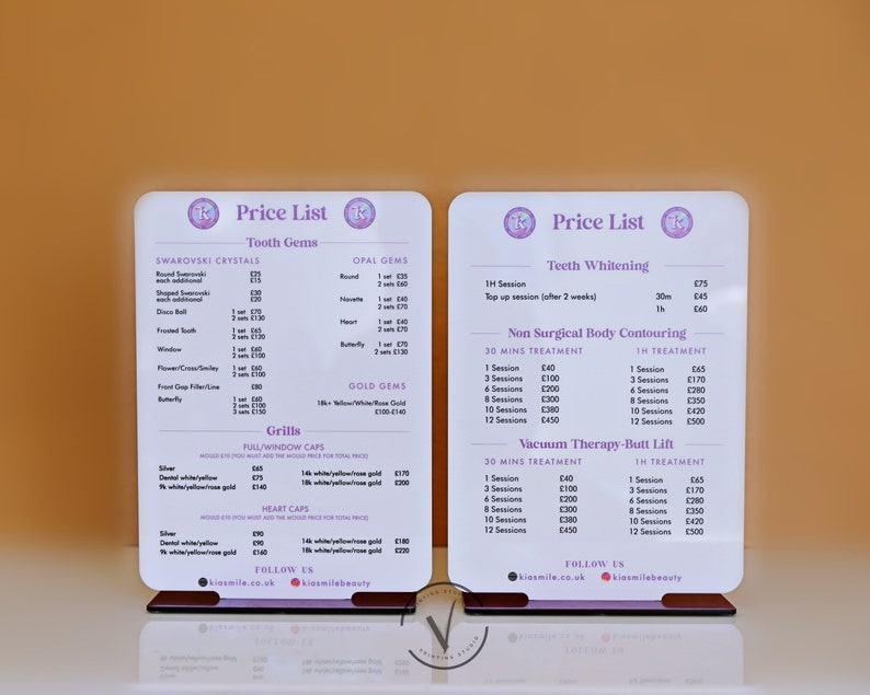 May include: Two white acrylic signs with a price list for tooth gems, teeth whitening, non-surgical body contouring, and vacuum therapy-butt lift. The signs have a pink and purple logo with the text "Kiesmile Beauty".