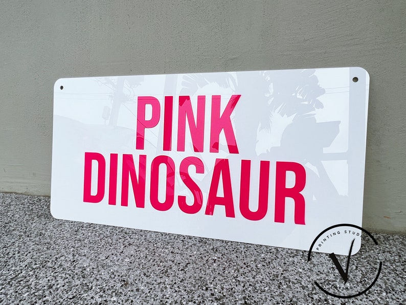 Custom Rectangle acrylic business sign in gloss white backing, PINK DINOSAUR in 3D hot pink acrylic on the sign using block sans font letter