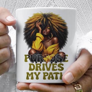 a woman holding a coffee mug with a picture of a woman with dreadlocks