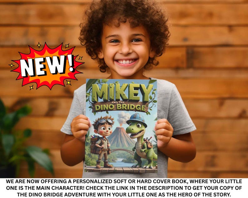 A young boy is holding a book titled "Mikey and the Dinosaur Bridge" and smiling, with a large "NEW!" explosion graphic above him.