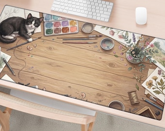 May include: A rectangular desk mat featuring a wooden plank surface design with a black and white cat, a watercolor paint set, various paintbrushes, a small vase of flowers, a spool of thread, and scattered sketches of floral illustrations.